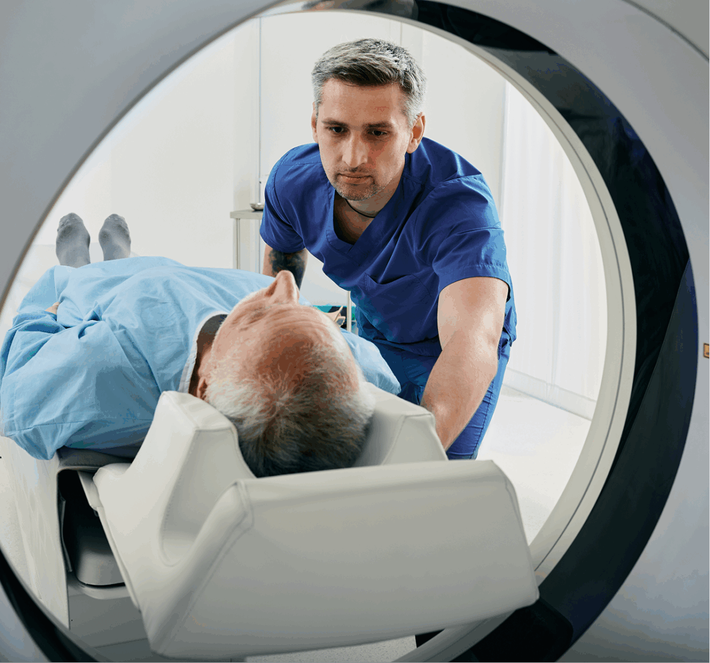 Radiologist taking care of patient in imaging machine.