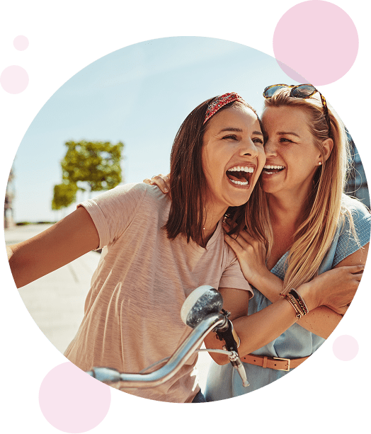 Laughing female friends having fun walking together.