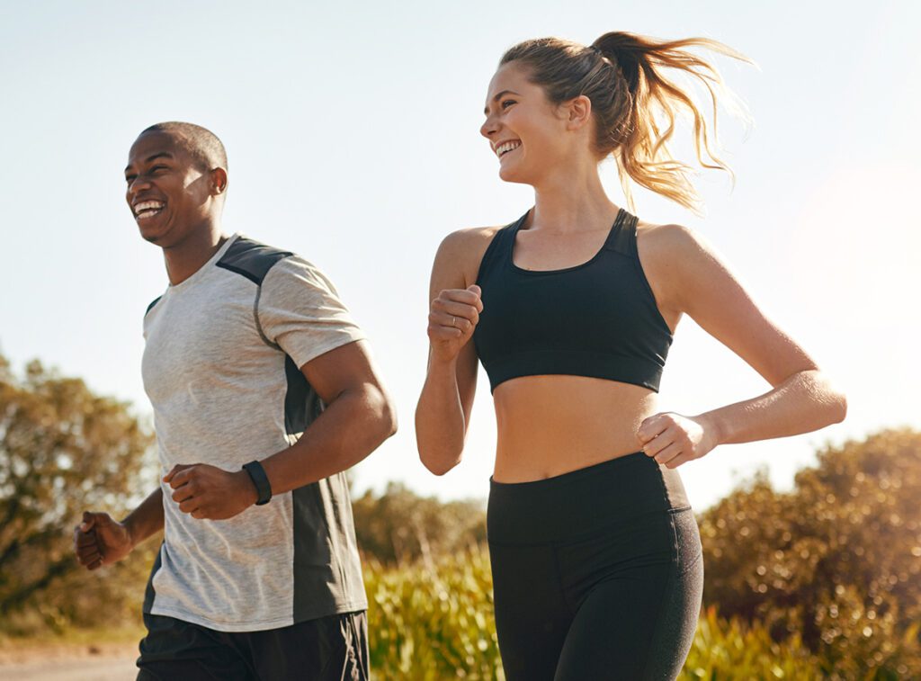 Young healthy couple running.