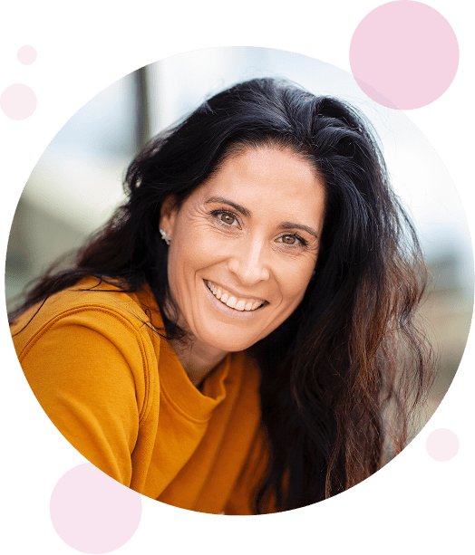 Women smiling for photo.