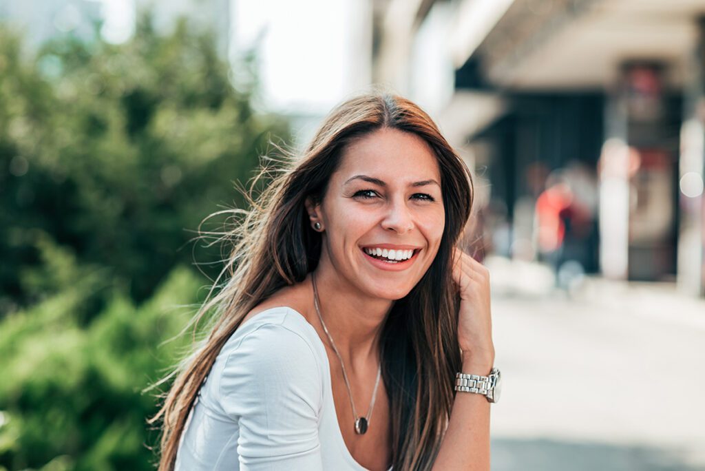 Women outside smiling for portrait.