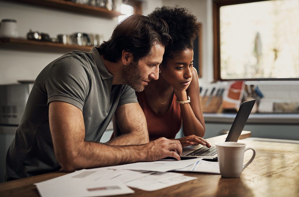 Couple with a laptop doing finance paper work